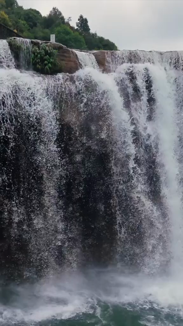 Vertical Aerial View of Krang Suri Falls and Lush Forest Landscape Meghalaya