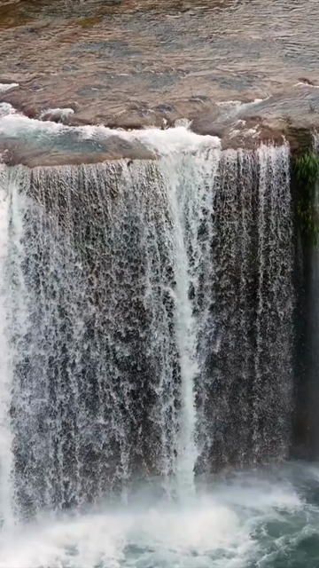 Vertical Aerial View of Krang Suri Falls and Lush Forest Landscape Meghalaya