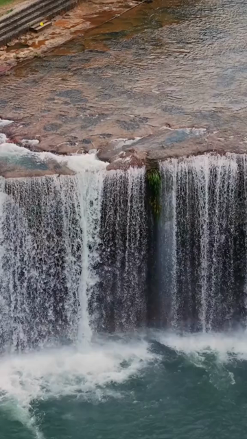 Vertical Aerial View of Krang Suri Falls and Lush Forest Landscape Meghalaya