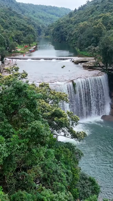 Vertical Aerial View of Krang Suri Falls and Lush Forest Landscape Meghalaya