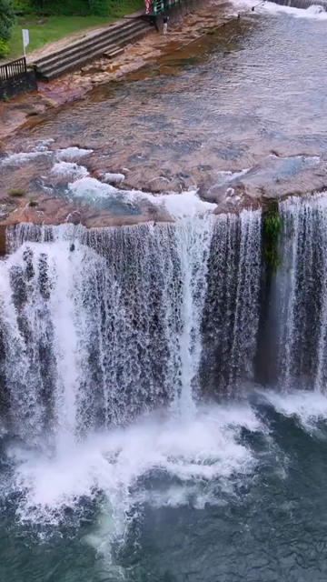 Vertical Aerial View of Krang Suri Falls and Lush Forest Landscape Meghalaya