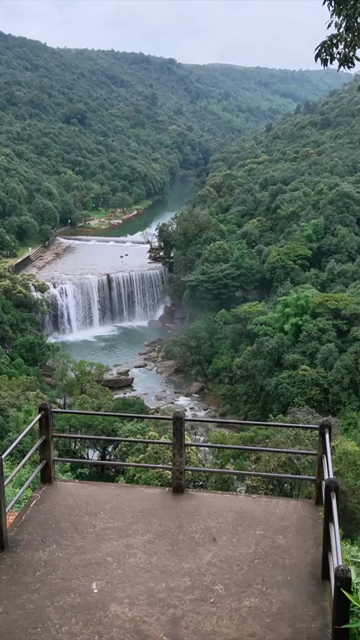 Vertical Aerial View of Krang Suri Falls and Lush Forest Landscape Meghalaya