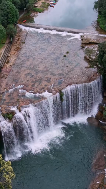 Vertical Aerial View of Krang Suri Falls and Lush Forest Landscape Meghalaya