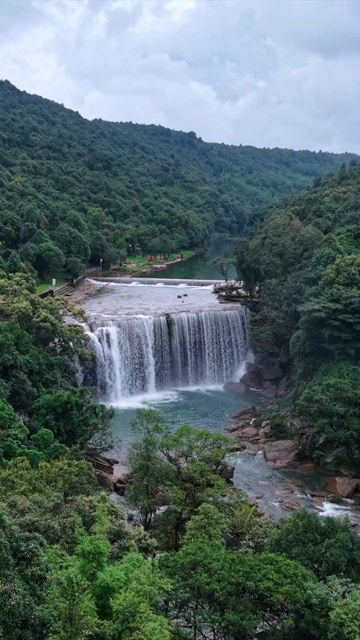 Vertical Aerial View of Krang Suri Falls and Lush Forest Landscape Meghalaya