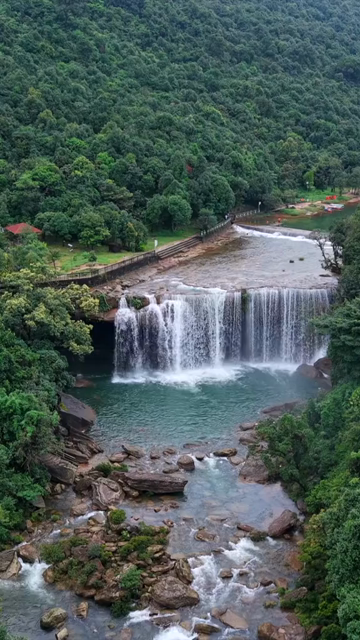 Vertical Aerial View of Krang Suri Falls and Lush Forest Landscape Meghalaya