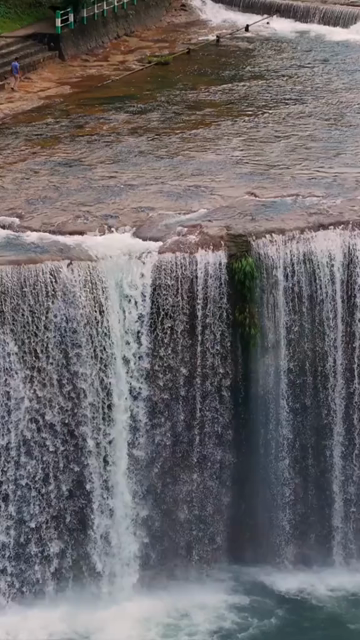 Vertical Aerial View of Krang Suri Falls and Lush Forest Landscape Meghalaya