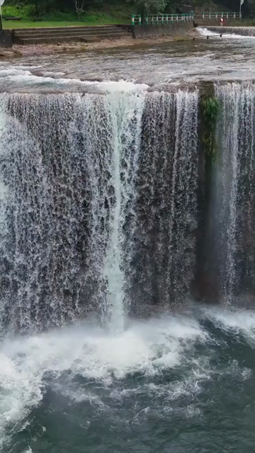 Vertical Aerial View of Krang Suri Falls and Lush Forest Landscape Meghalaya
