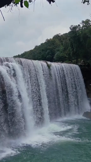 Vertical Aerial View of Krang Suri Falls and Lush Forest Landscape Meghalaya