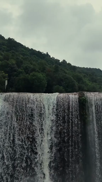 Vertical Aerial View of Krang Suri Falls and Lush Forest Landscape Meghalaya
