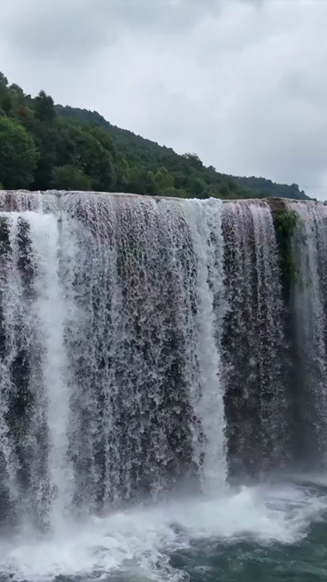 Vertical Aerial View of Krang Suri Falls and Lush Forest Landscape Meghalaya
