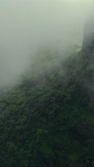Vertical Aerial View of Kumbhe Plateau and Misty Sahyadri Mountain Cliffs Maharashtra