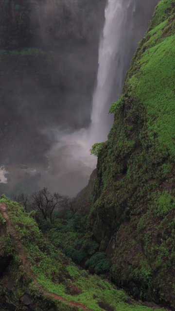 Vertical Aerial View of Kumbhe Waterfall and Misty Cliffs Maharashtra