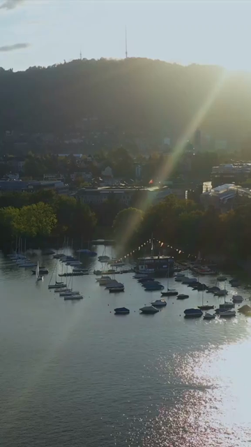 Vertical Aerial View of Lake Zurich and Sailboat in Switzerland