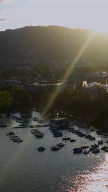Vertical Aerial View of Lake Zurich and Sailboat in Switzerland