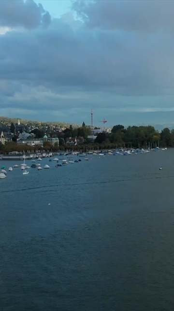 Vertical Aerial View of Lake Zurich and Sailboat in Switzerland