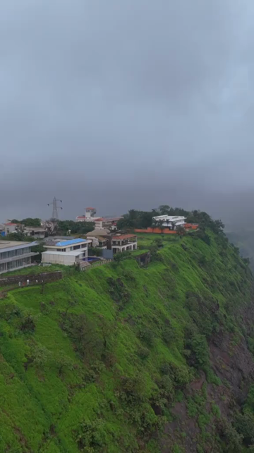 Vertical Aerial View of Lonavala Waterfall and Misty Green Hills During Monsoon Maharashtra