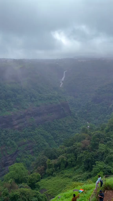 Vertical Aerial View of Lonavala Waterfall and Misty Green Hills During Monsoon Maharashtra