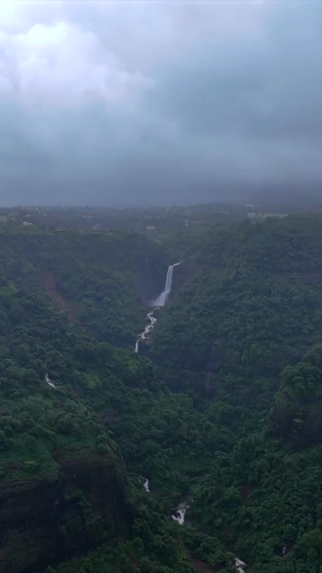 Vertical Aerial View of Lonavala Waterfall and Misty Green Hills During Monsoon Maharashtra