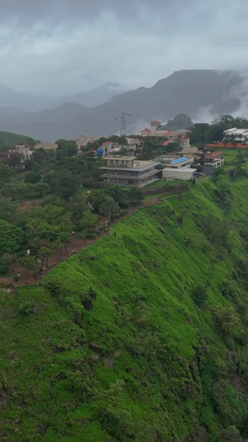 Vertical Aerial View of Lonavala Waterfall and Misty Green Hills During Monsoon Maharashtra