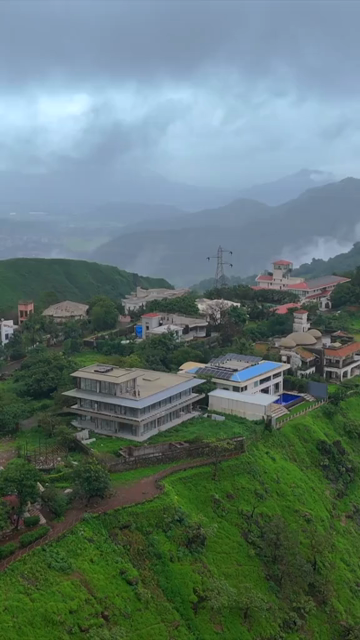 Vertical Aerial View of Lonavala Waterfall and Misty Green Hills During Monsoon Maharashtra