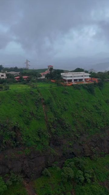 Vertical Aerial View of Lonavala Waterfall and Misty Green Hills During Monsoon Maharashtra