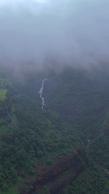 Vertical Aerial View of Lonavala Waterfall and Misty Green Hills During Monsoon Maharashtra