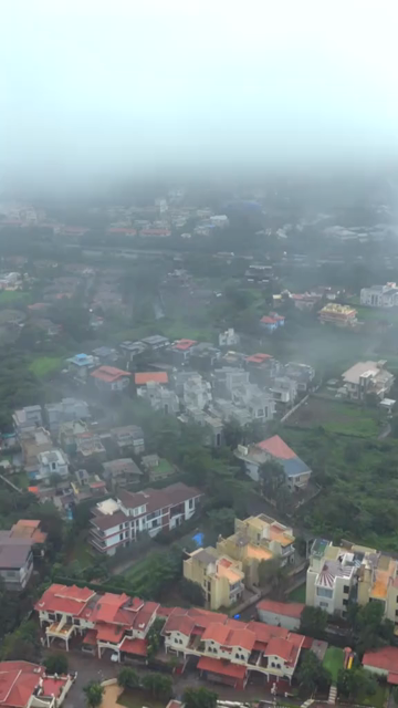 Vertical Aerial View of Lonavala Waterfall and Misty Green Hills During Monsoon Maharashtra