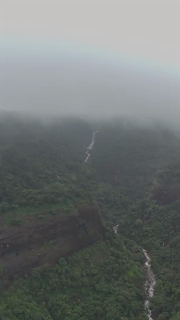 Vertical Aerial View of Lonavala Waterfall and Misty Green Hills During Monsoon Maharashtra