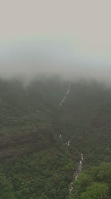 Vertical Aerial View of Lonavala Waterfall and Misty Green Hills During Monsoon Maharashtra