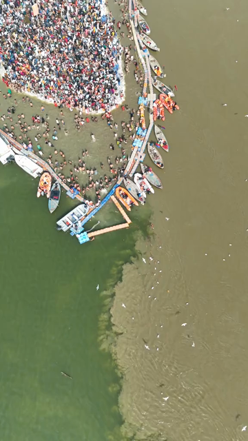 Vertical Aerial View of Pilgrims Gathering at Maha Kumbh Mela in Prayagraj India