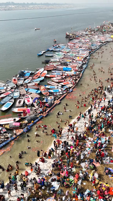 Vertical Aerial View of Pilgrims Gathering at Maha Kumbh Mela in Prayagraj India