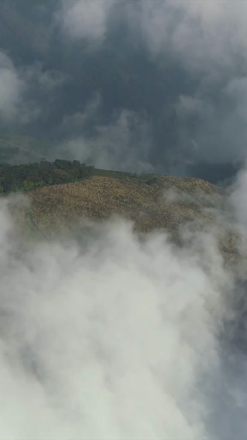 Vertical Aerial View of Mist Covered Hills at Kolukkumalai Munnar Kerala India