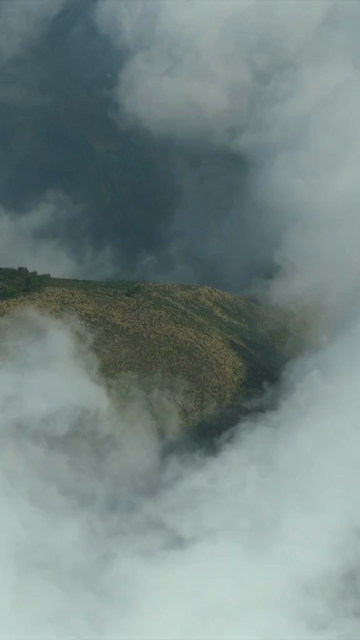 Vertical Aerial View of Mist Covered Hills at Kolukkumalai Munnar Kerala India