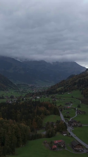 Vertical Aerial View of Misty Swiss Alps Landscape Switzerland