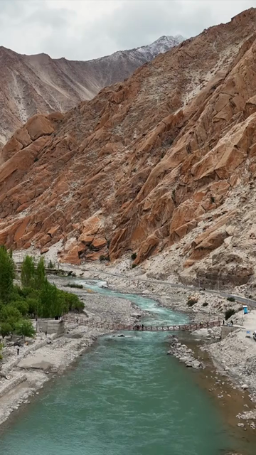 Vertical Aerial View of Mountain River and Rugged Himalayan Landscape in Ladakh India