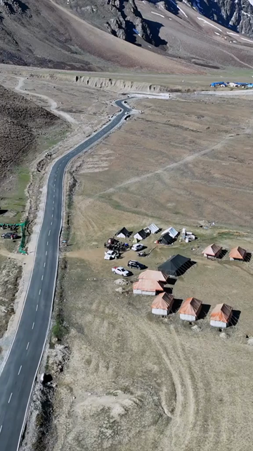 Vertical Aerial View of Mountain Road and Campsite in the Landscapes of Ladakh India