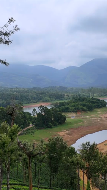 Vertical Aerial View of Scenic Mountain Landscape and Lake in Kerala India