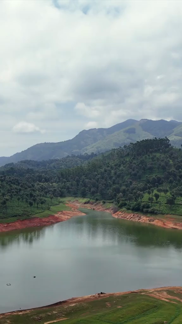 Vertical Aerial View of Scenic Mountain Landscape and Lake in Kerala India
