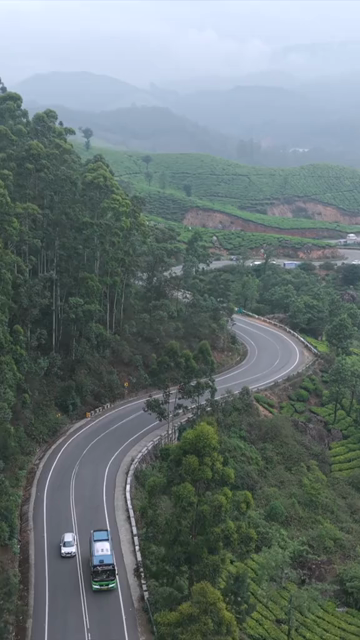 Vertical Aerial View of Scenic Mountain Roads and Tea Plantations in Munnar Kerala India