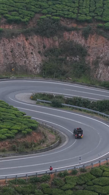 Vertical Aerial View of Scenic Mountain Roads and Tea Plantations in Munnar Kerala India