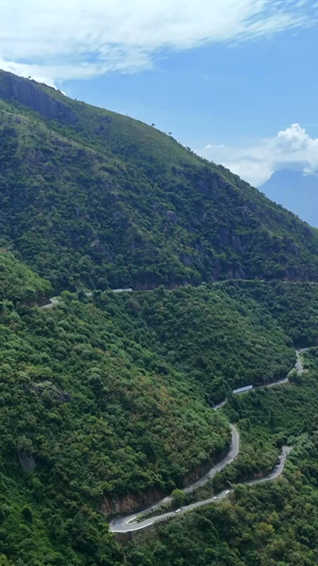 Vertical Aerial View of Scenic Mountain Roads and Tea Plantations in Munnar Kerala India