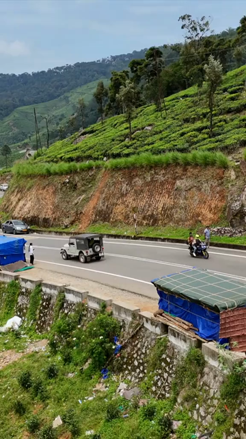 Vertical Aerial View of Scenic Mountain Roads and Tea Plantations in Munnar Kerala India