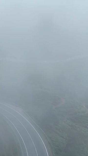 Vertical Aerial View of Scenic Mountain Roads and Tea Plantations in Munnar Kerala India