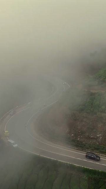 Vertical Aerial View of Scenic Mountain Roads and Tea Plantations in Munnar Kerala India