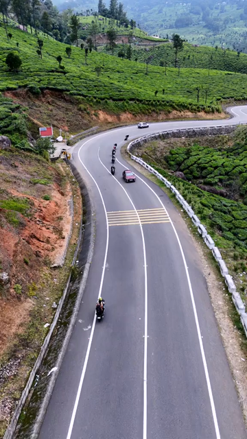 Vertical Aerial View of Scenic Mountain Roads and Tea Plantations in Munnar Kerala India