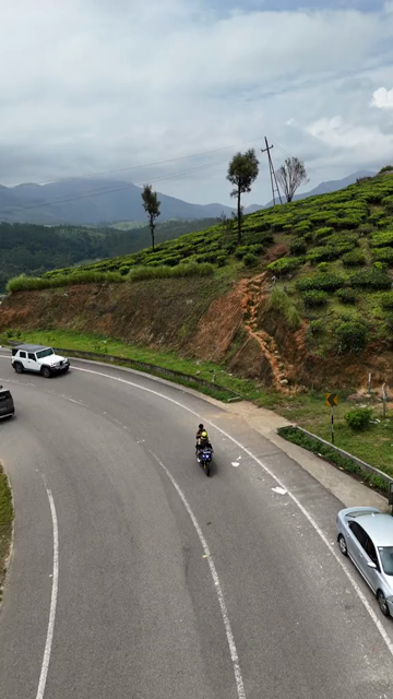 Vertical Aerial View of Scenic Mountain Roads and Tea Plantations in Munnar Kerala India