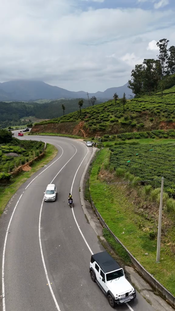 Vertical Aerial View of Scenic Mountain Roads and Tea Plantations in Munnar Kerala India