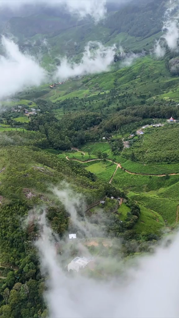 Vertical Aerial View of Scenic Mountain Roads and Tea Plantations in Munnar Kerala India