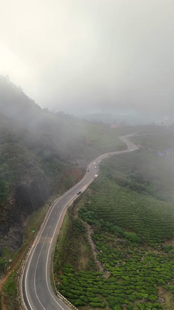 Vertical Aerial View of Scenic Mountain Roads and Tea Plantations in Munnar Kerala India