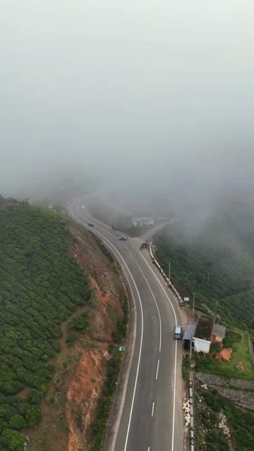 Vertical Aerial View of Scenic Mountain Roads and Tea Plantations in Munnar Kerala India